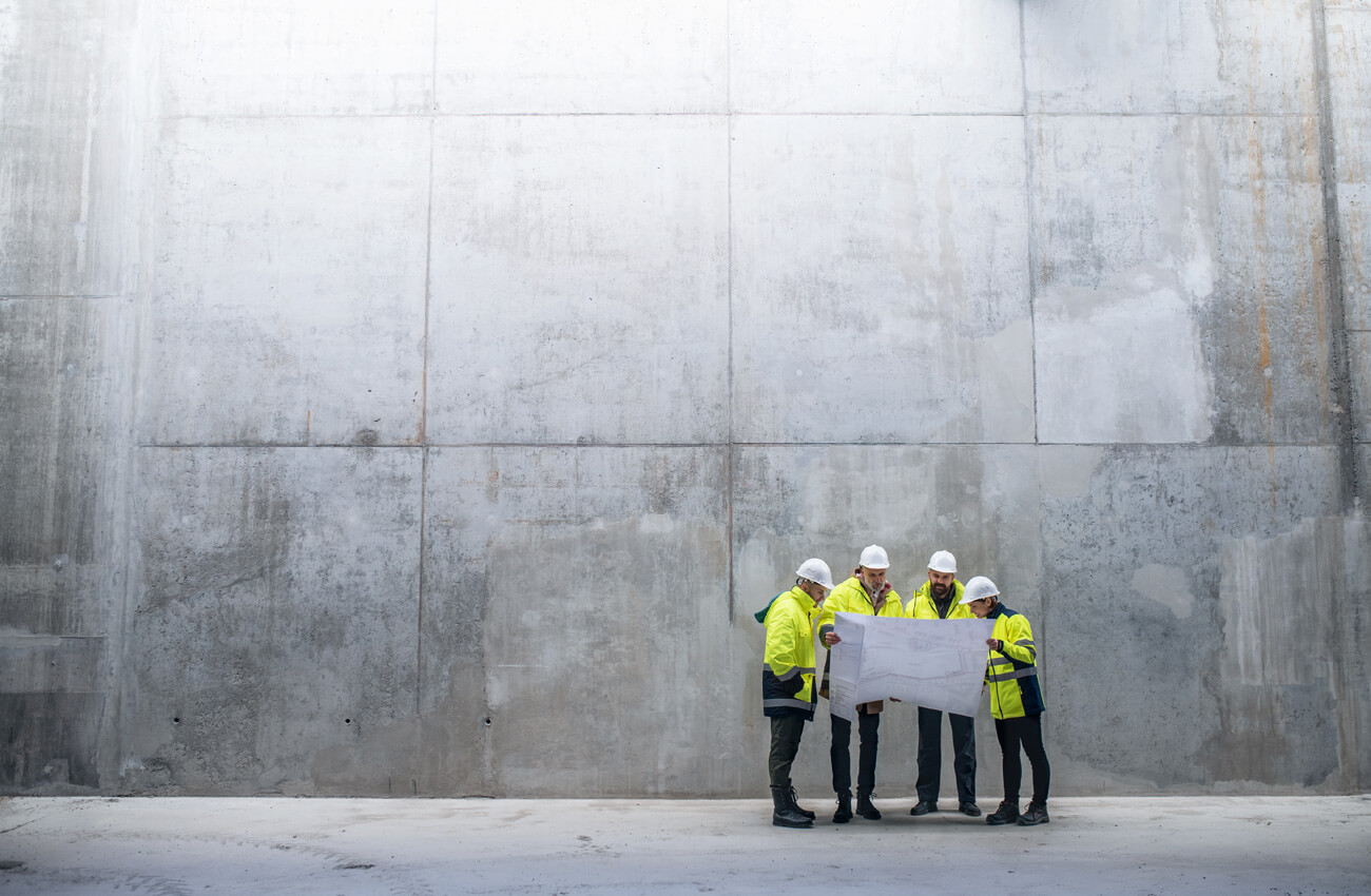 Construction workers looking at site plans