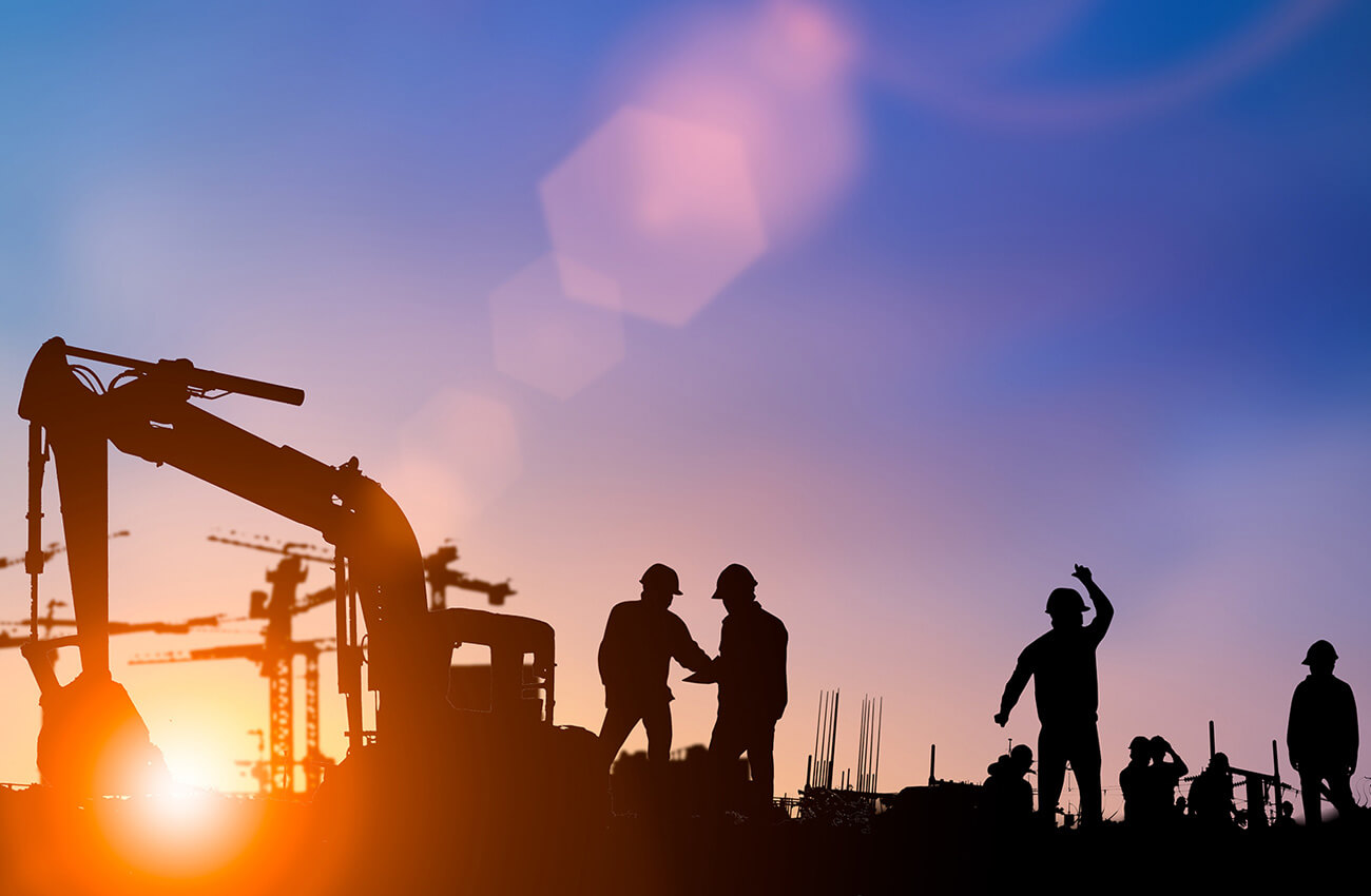Silhouette of construction workers onsite